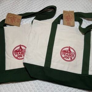 Set of 2 of the latest Trader Joe's Canvas Tote Bags with green handles and trim